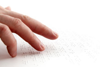 Fingers reading Braille